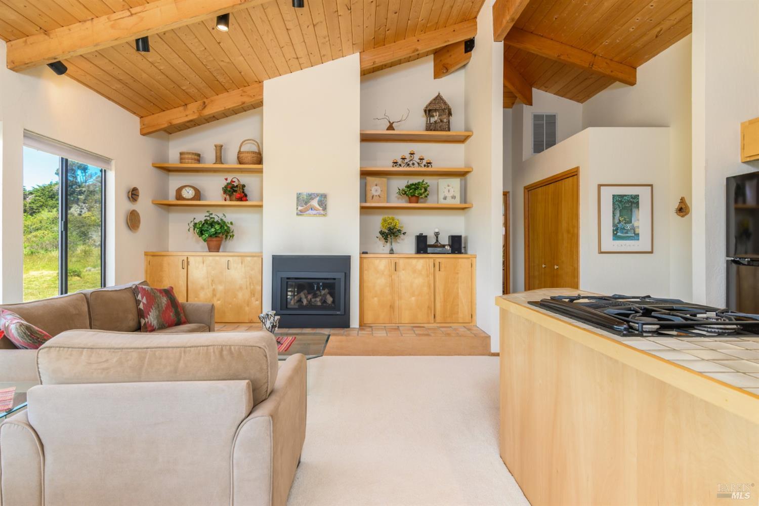 267 Sea Stack The Sea Ranch, CA 95497 - Photo 20 of 35 a living room with furniture and a fireplace