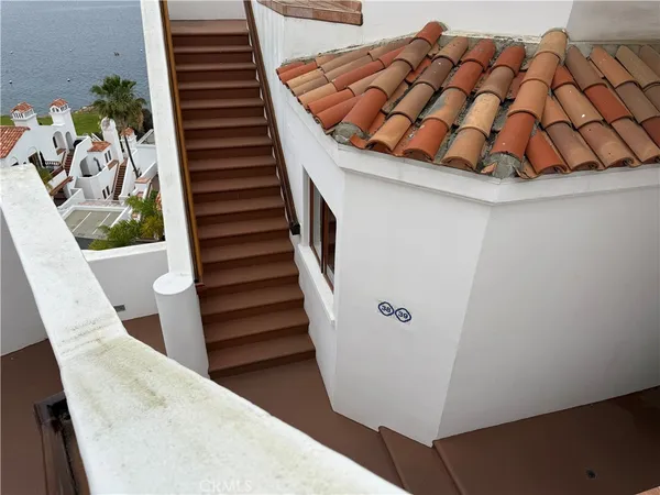 a view of staircase with wooden floor