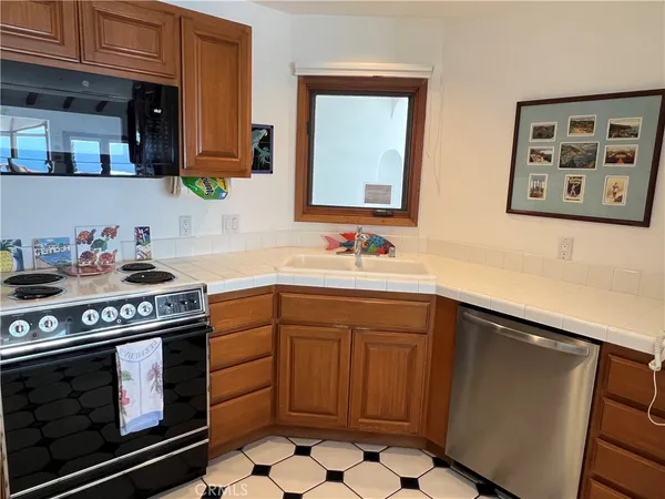 a kitchen with a stove and cabinets
