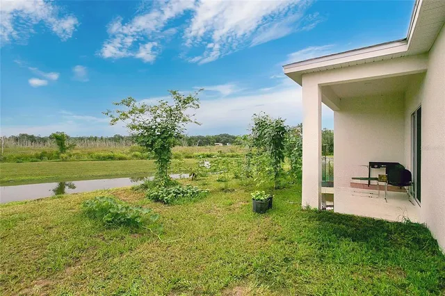 a view of a lake with a big yard