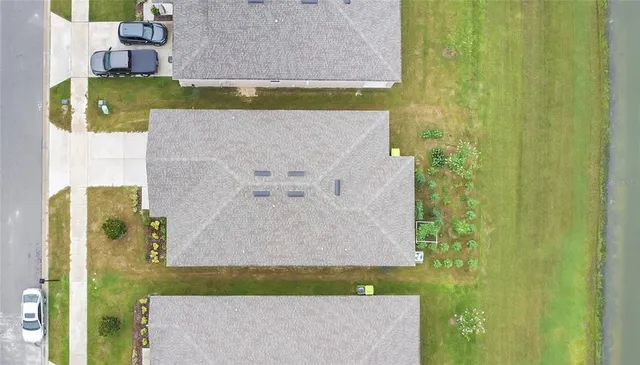 swimming pool view with a garden