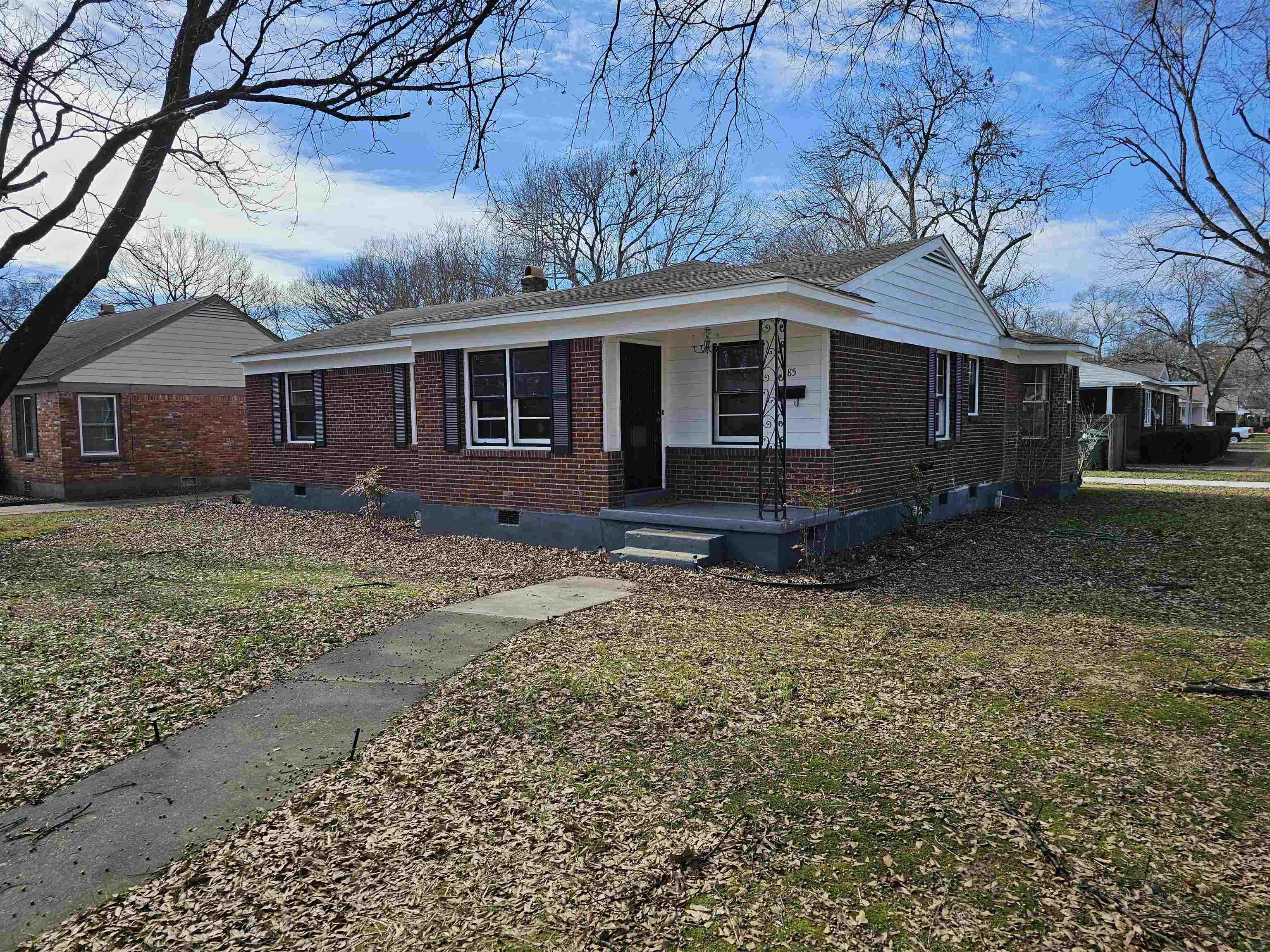 1485 Ivy Road Memphis, TN 38117 - Photo 1 of 22 front view of a house with a yard