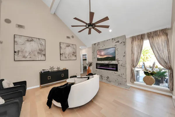 a living room with furniture and a flat screen tv