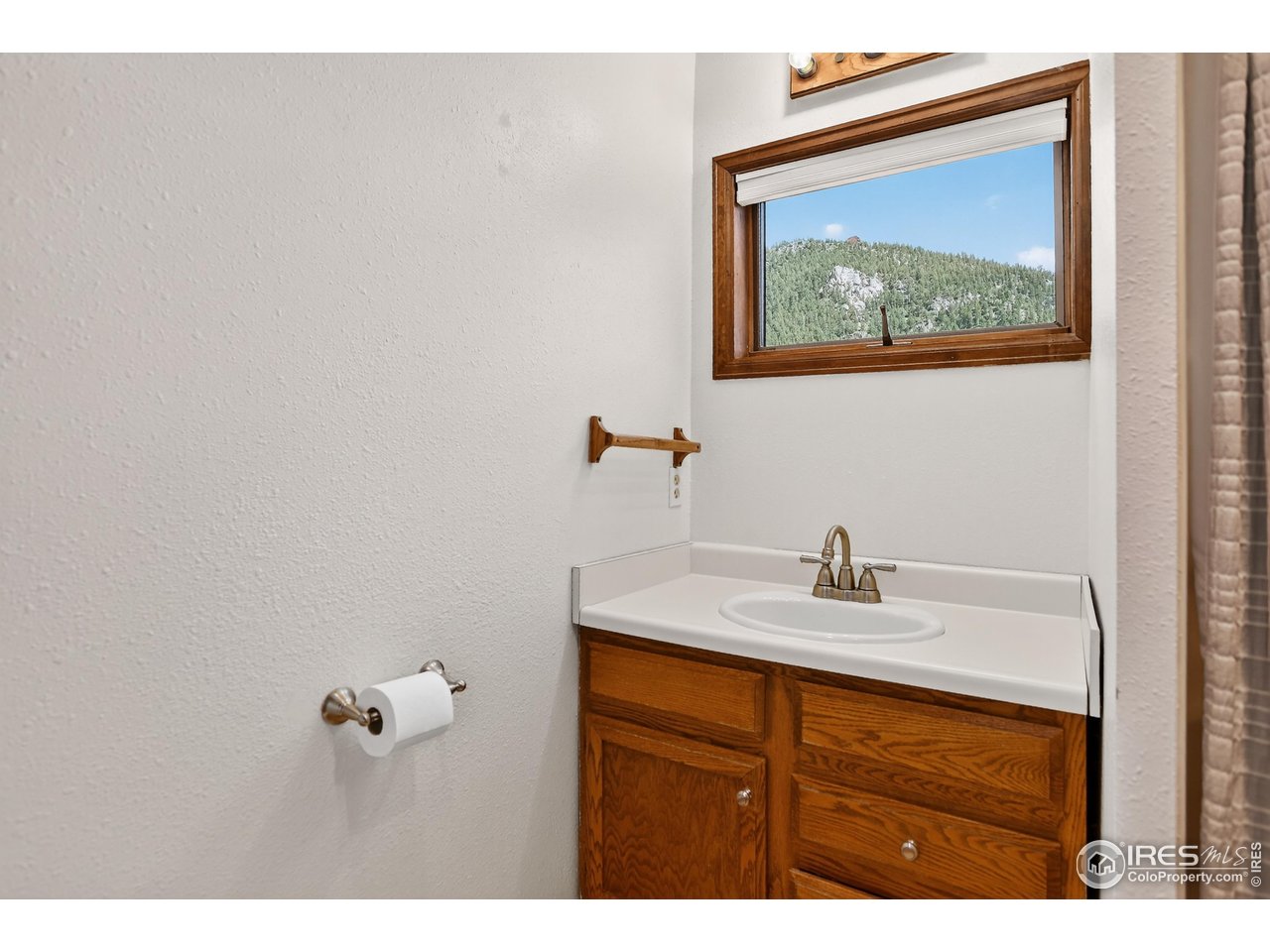 192 Nugget Hill Road Jamestown, CO 80455 - Photo 7 of 25 Downstairs bathroom (sink pictured with shower adjacent)