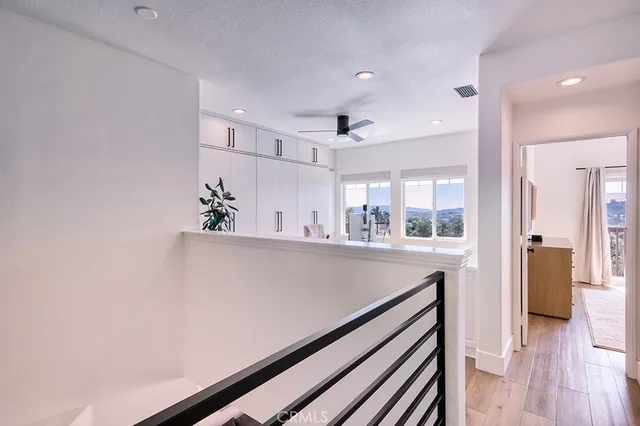 a view of kitchen with furniture and wooden floor