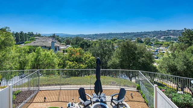 a view of balcony with furniture