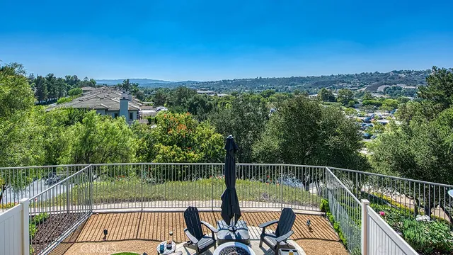a view of balcony with furniture