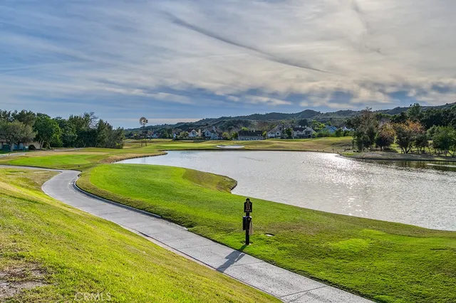 a view of a golf course with a lake