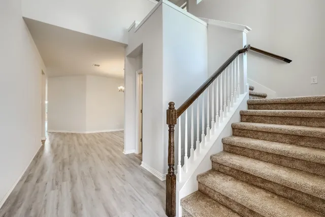 a view of entryway with wooden floor