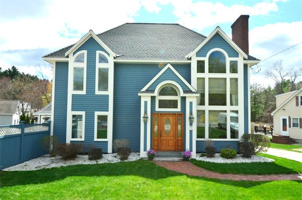 150 Dunstable Road Chelmsford, MA 01863 - Photo 1 of 30 a front view of a house with a yard