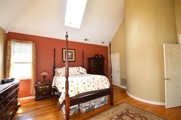 150 Dunstable Road Chelmsford, MA 01863 - Photo 11 of 30 a bed sitting in a bedroom next to a window