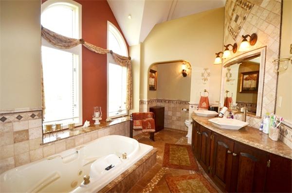150 Dunstable Road Chelmsford, MA 01863 - Photo 12 of 30 a large bathroom with a large tub sink and mirror