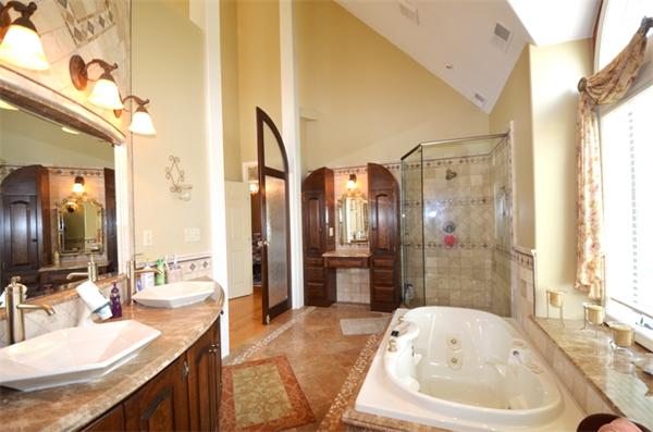 150 Dunstable Road Chelmsford, MA 01863 - Photo 13 of 30 a bathroom with a tub sink and mirror