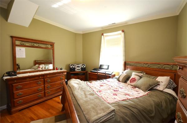 150 Dunstable Road Chelmsford, MA 01863 - Photo 14 of 30 a bedroom with a bed and a mirror on dresser