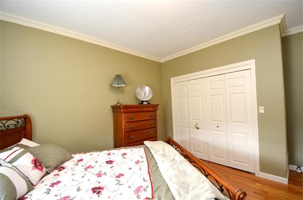 150 Dunstable Road Chelmsford, MA 01863 - Photo 15 of 30 a bedroom with a bed and cabinet