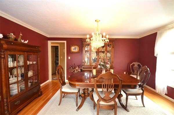 150 Dunstable Road Chelmsford, MA 01863 - Photo 5 of 30 a view of a dining room with furniture and chandelier