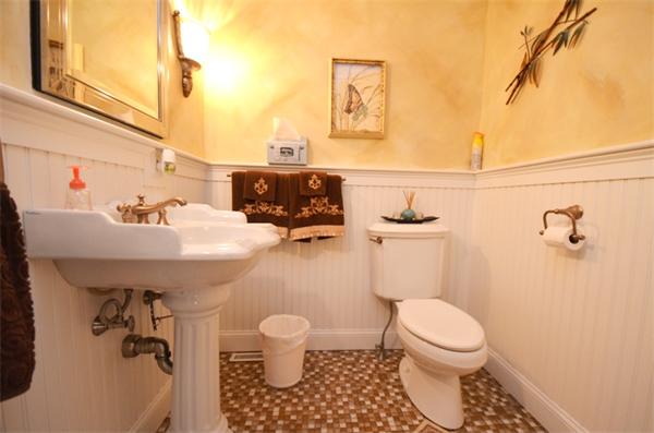 150 Dunstable Road Chelmsford, MA 01863 - Photo 9 of 30 a bathroom with a sink a toilet and a mirror