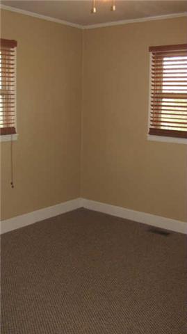2251 Mansford Road Winchester, TN 37398 - Photo 13 of 18 4th bedroom has carpet, ceiling fan, and could be used as an office or library.