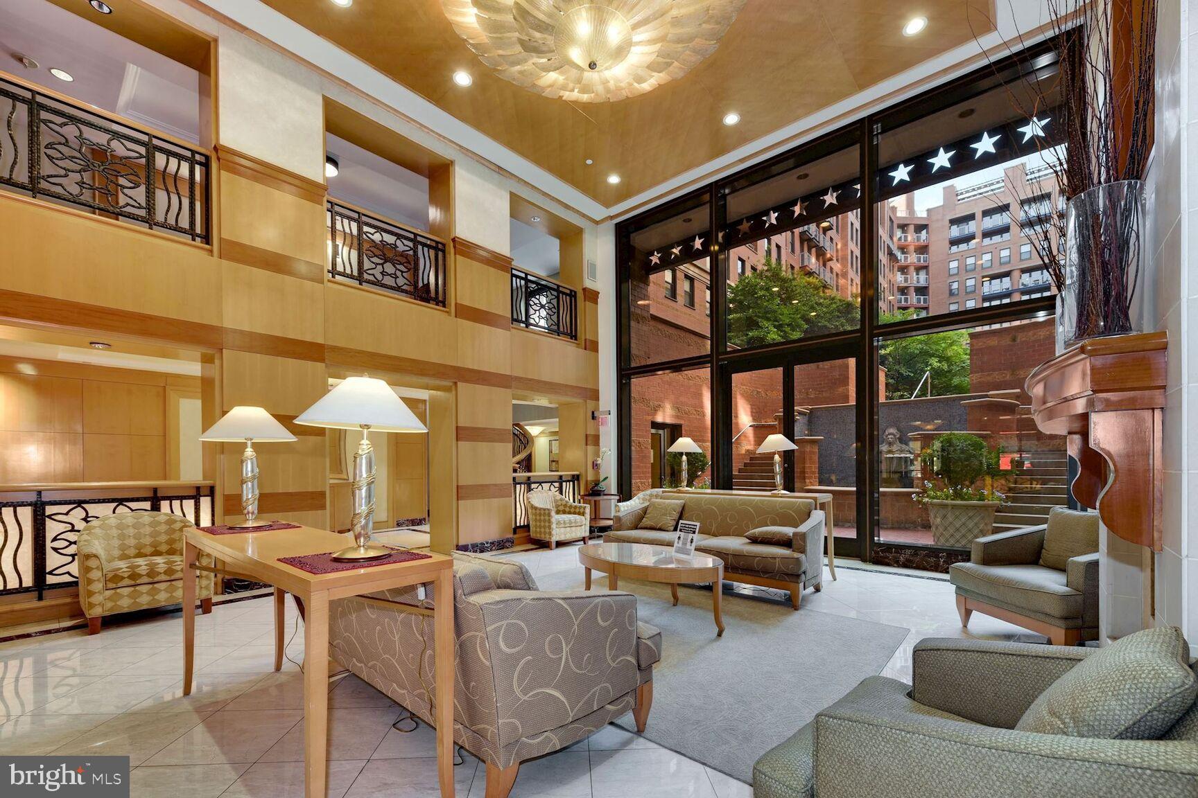 616 E Street Northwest, Unit 807 Washington, DC 20004 - Photo 17 of 24 a living room with furniture and a large window