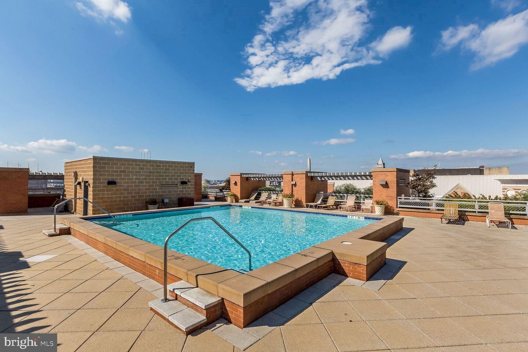 616 E Street Northwest, Unit 807 Washington, DC 20004 - Photo 19 of 24 a view of a patio with swimming pool