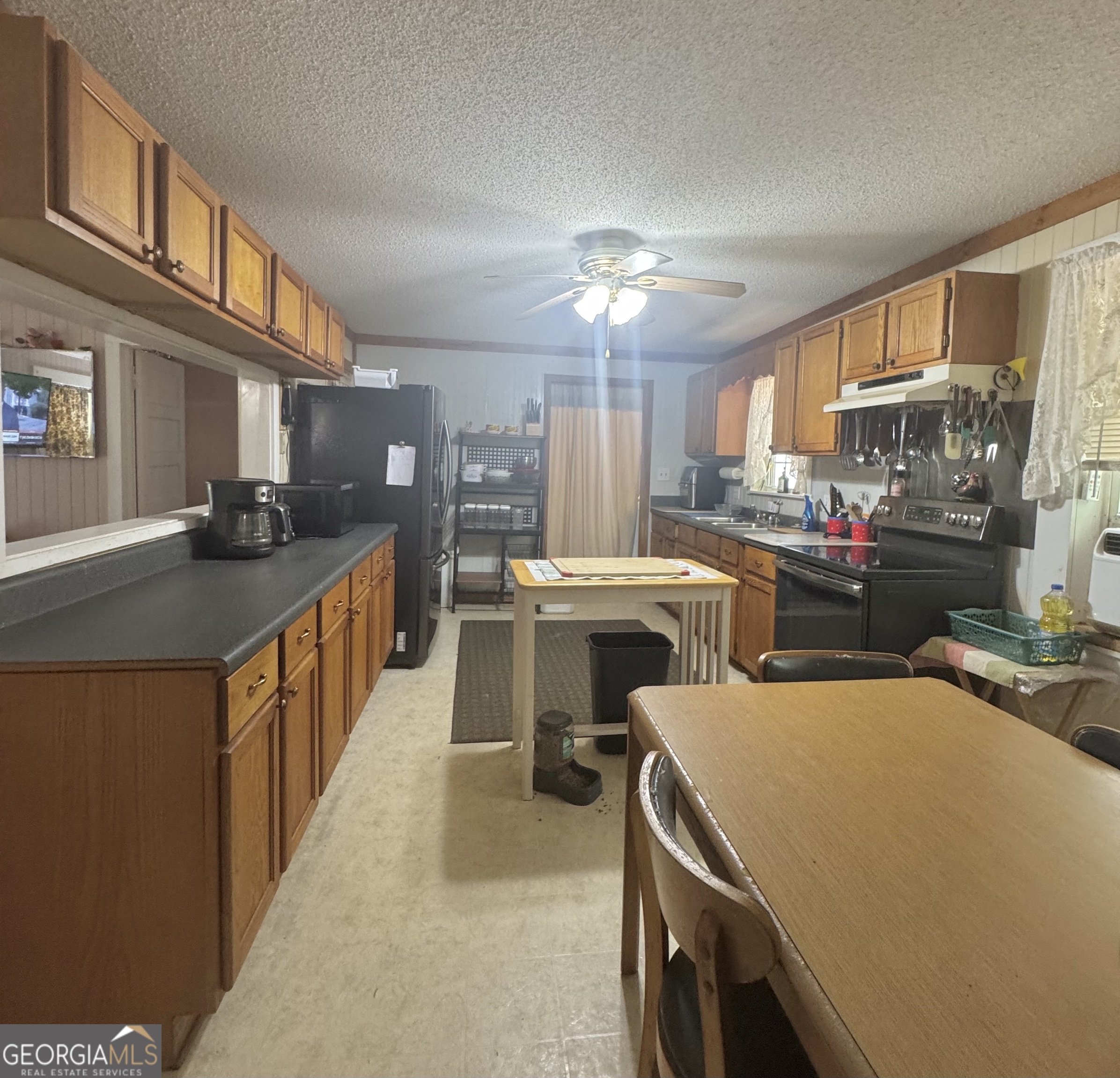 75 Rudolph Road Collins, GA 30421 - Photo 13 of 15 a kitchen with a sink appliances and cabinets