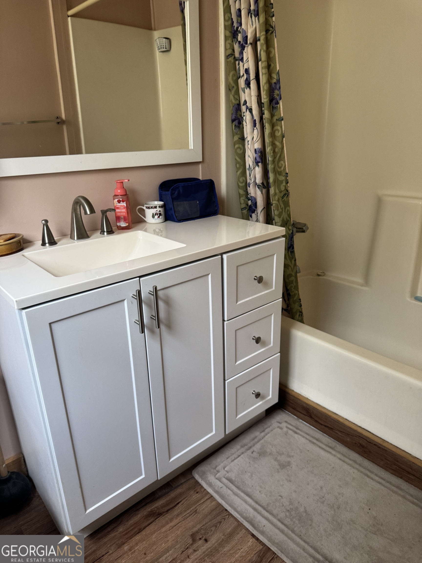 75 Rudolph Road Collins, GA 30421 - Photo 8 of 15 a bathroom with a sink and a mirror