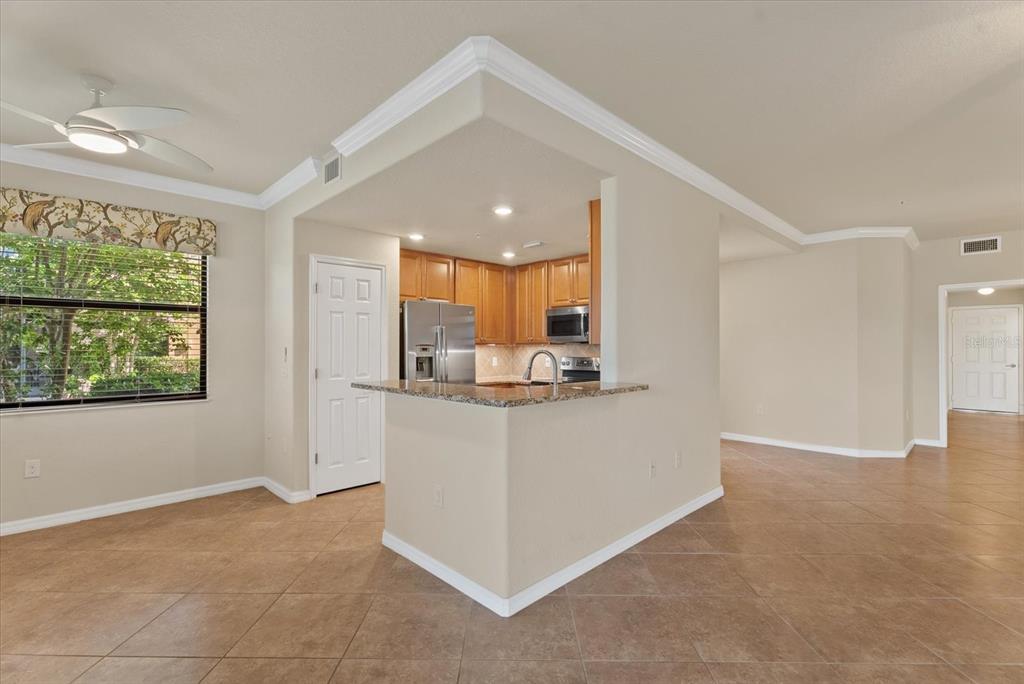 20080 Ragazza Circle, Unit 102 Venice, FL 34293 - Photo 19 of 49 a view of kitchen cabinets and window