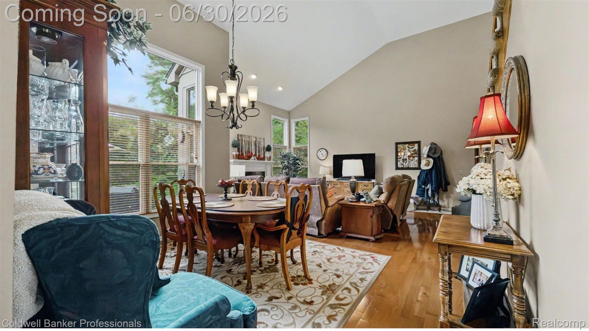 1085 Bloomview Circle Rochester, MI 48307 - Photo 21 of 67 Vaulted ceilings featuring a chandelier, hardwood flooring, and abundant natural light through large windows