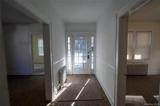 a kitchen with a sink cabinets stainless steel appliances and a window