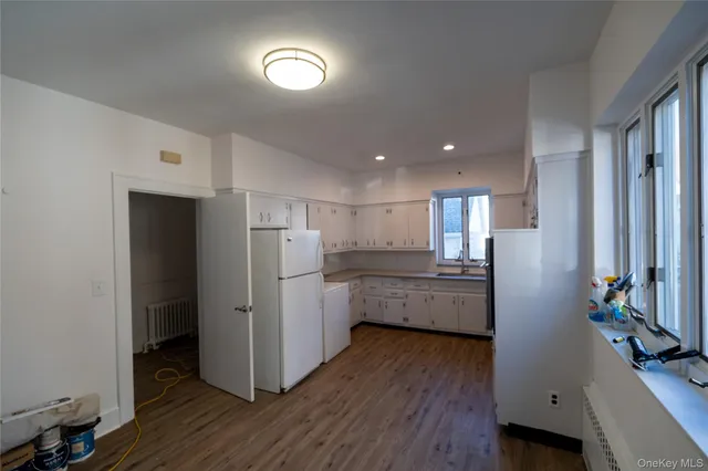 a kitchen with sink microwave and stove