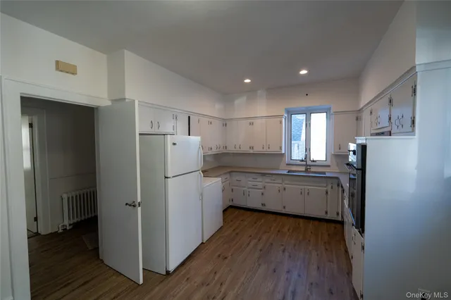 a kitchen with a refrigerator stove and microwave