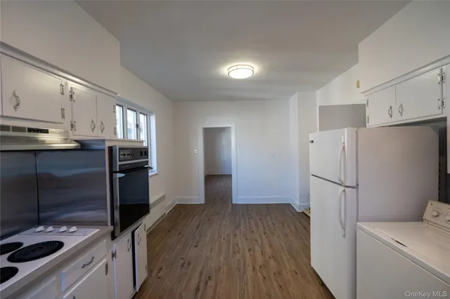 a view of a hallway with a room