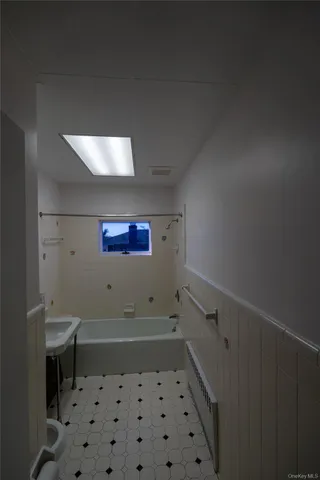 a bathroom with a sink and a bathtub
