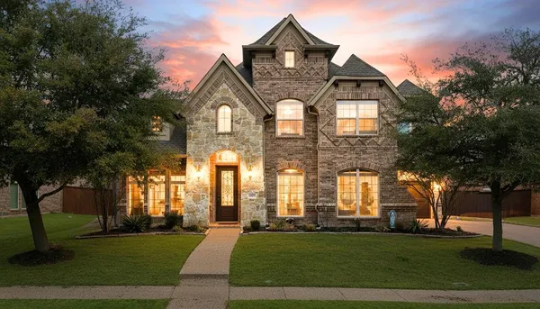 a front view of a building with a yard