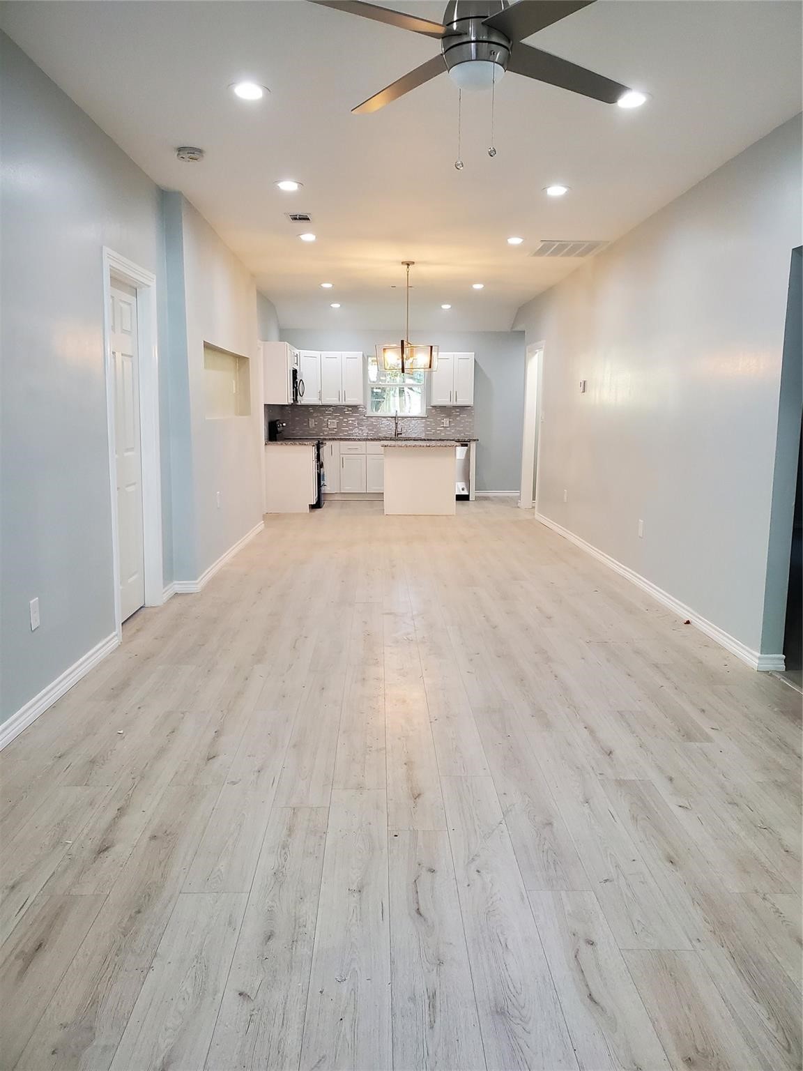 6815 Sidney Street Houston, TX 77021 - Photo 6 of 14 a view of kitchen with wooden floor