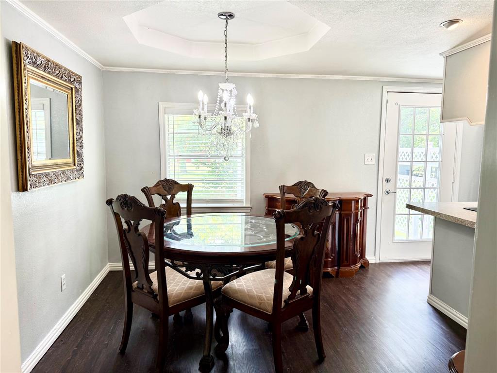 4216 Greenwood Road Weatherford, TX 76088 - Photo 5 of 24 a view of a dining room with furniture window and wooden floor