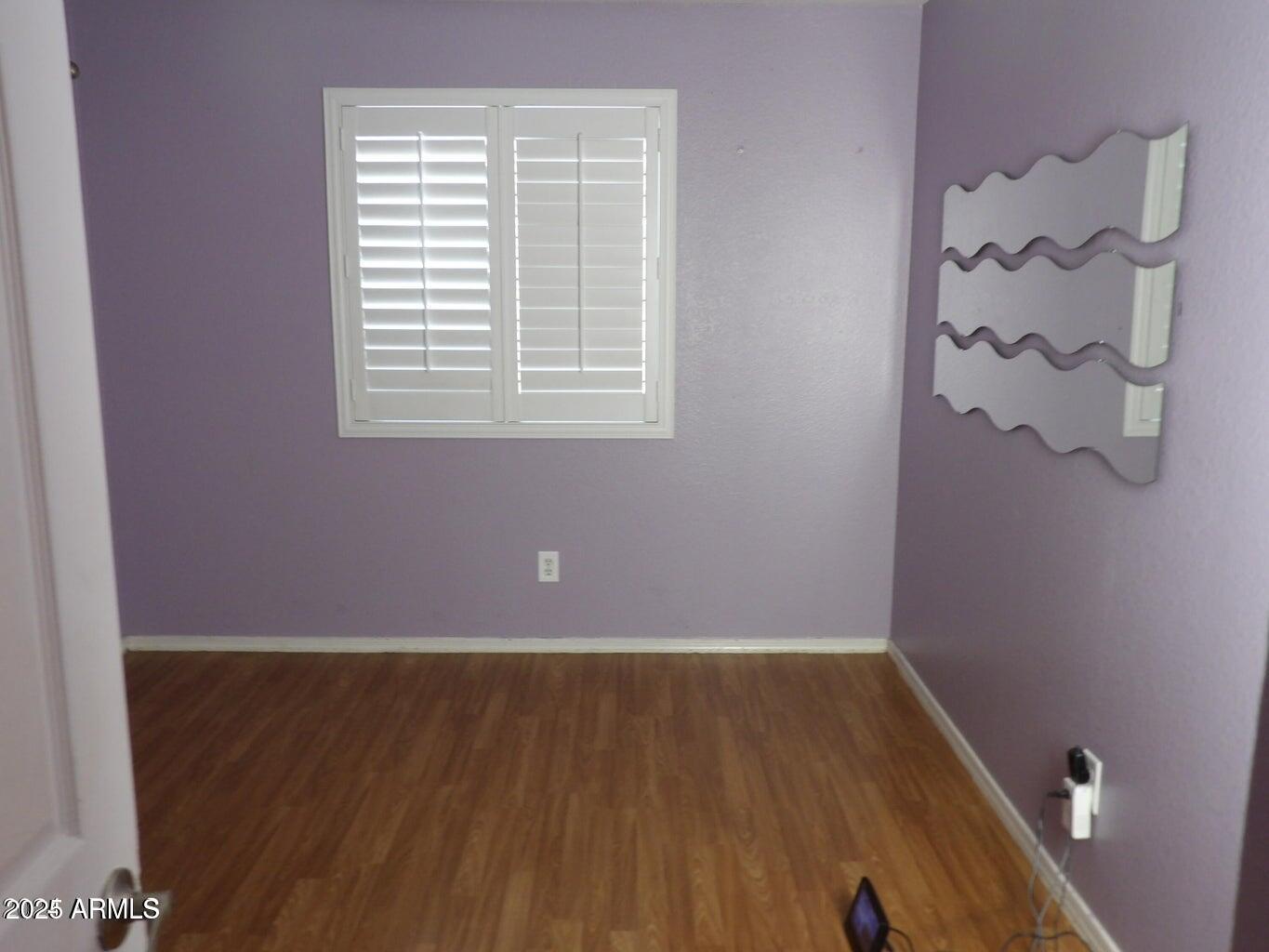 8221 West Papago Street Phoenix, AZ 85043 - Photo 18 of 20 a view of a room with wooden floor and a window