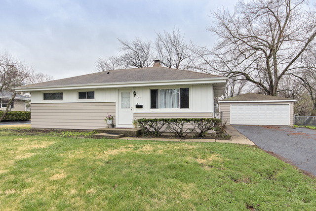 a view of a house with a yard patio and a yard