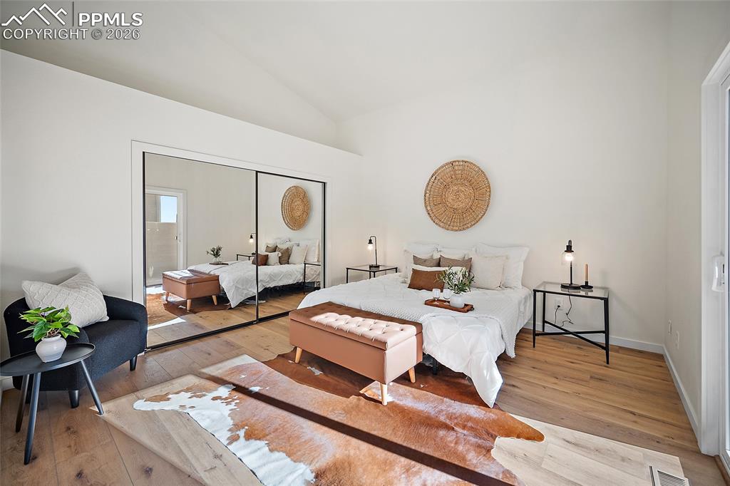 62 Rising Sun Terrace Colorado Springs, CO 80921 - Photo 19 of 46 a living room with furniture a rug and a mirror