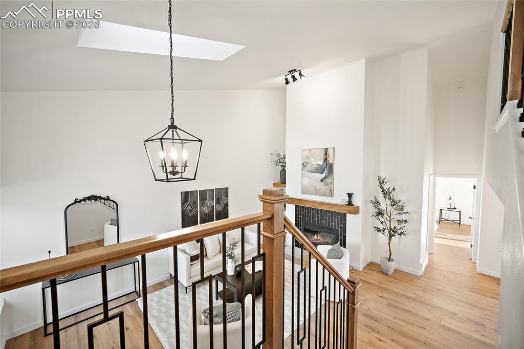 62 Rising Sun Terrace Colorado Springs, CO 80921 - Photo 22 of 46 a view of an entryway wooden floor and chandelier