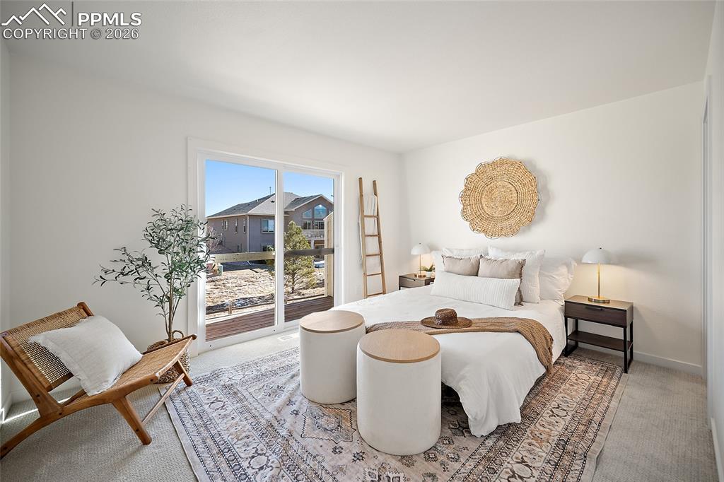 62 Rising Sun Terrace Colorado Springs, CO 80921 - Photo 23 of 46 a bed room with a bed and a chair