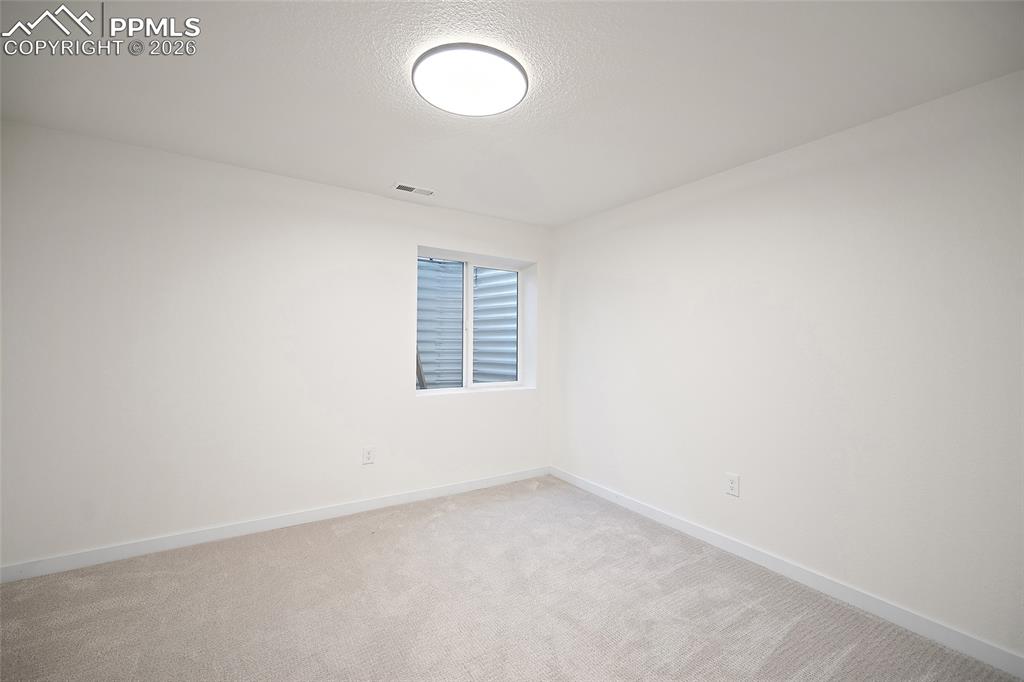 62 Rising Sun Terrace Colorado Springs, CO 80921 - Photo 32 of 46 an empty room with a window