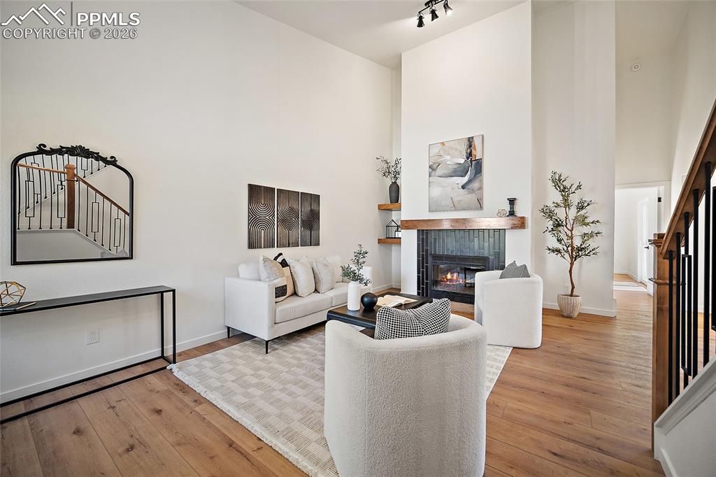 62 Rising Sun Terrace Colorado Springs, CO 80921 - Photo 6 of 46 a living room with furniture and a fireplace