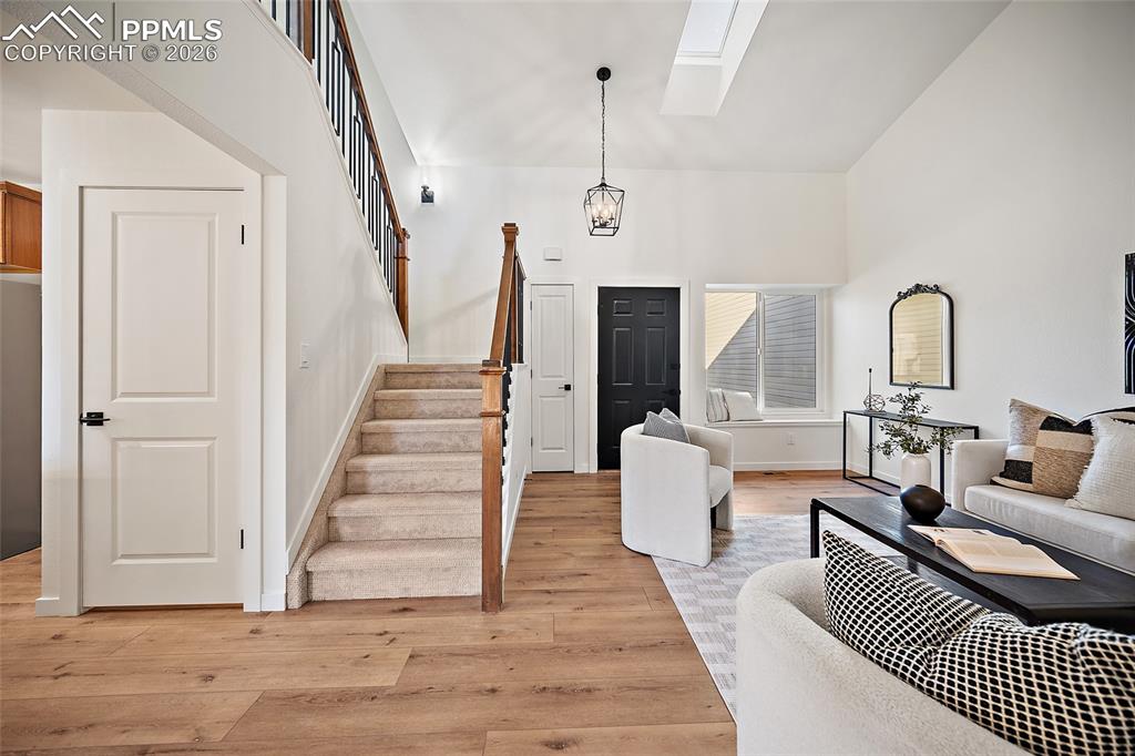 62 Rising Sun Terrace Colorado Springs, CO 80921 - Photo 7 of 46 a living room with furniture and a wooden floor