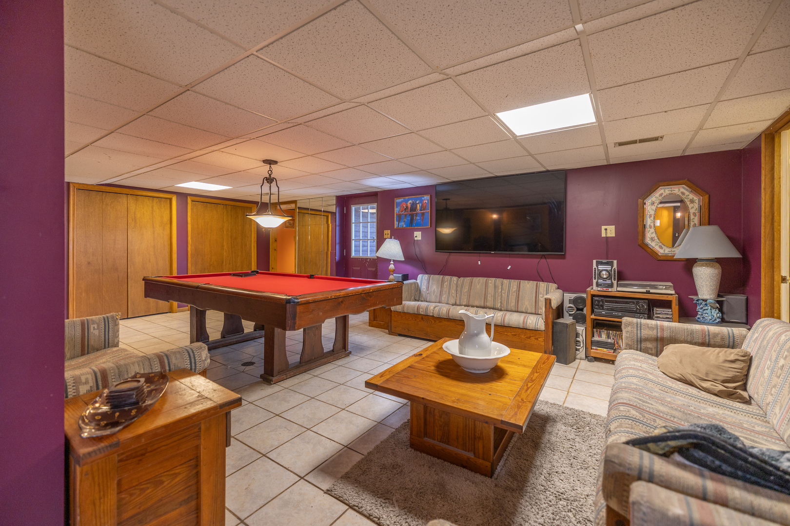 15534 Somonauk Road DeKalb, IL 60115 - Photo 22 of 48 a living room with furniture a flat screen tv and kitchen view
