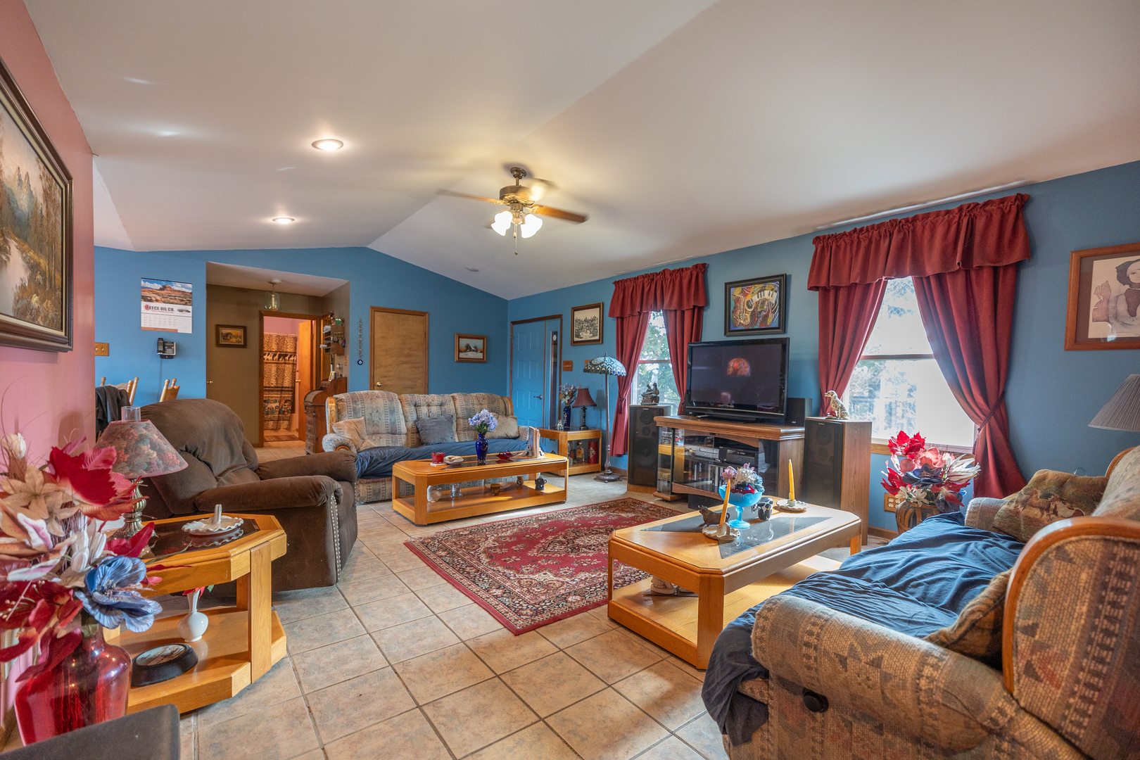 15534 Somonauk Road DeKalb, IL 60115 - Photo 7 of 48 a living room with furniture a flat screen tv and a window