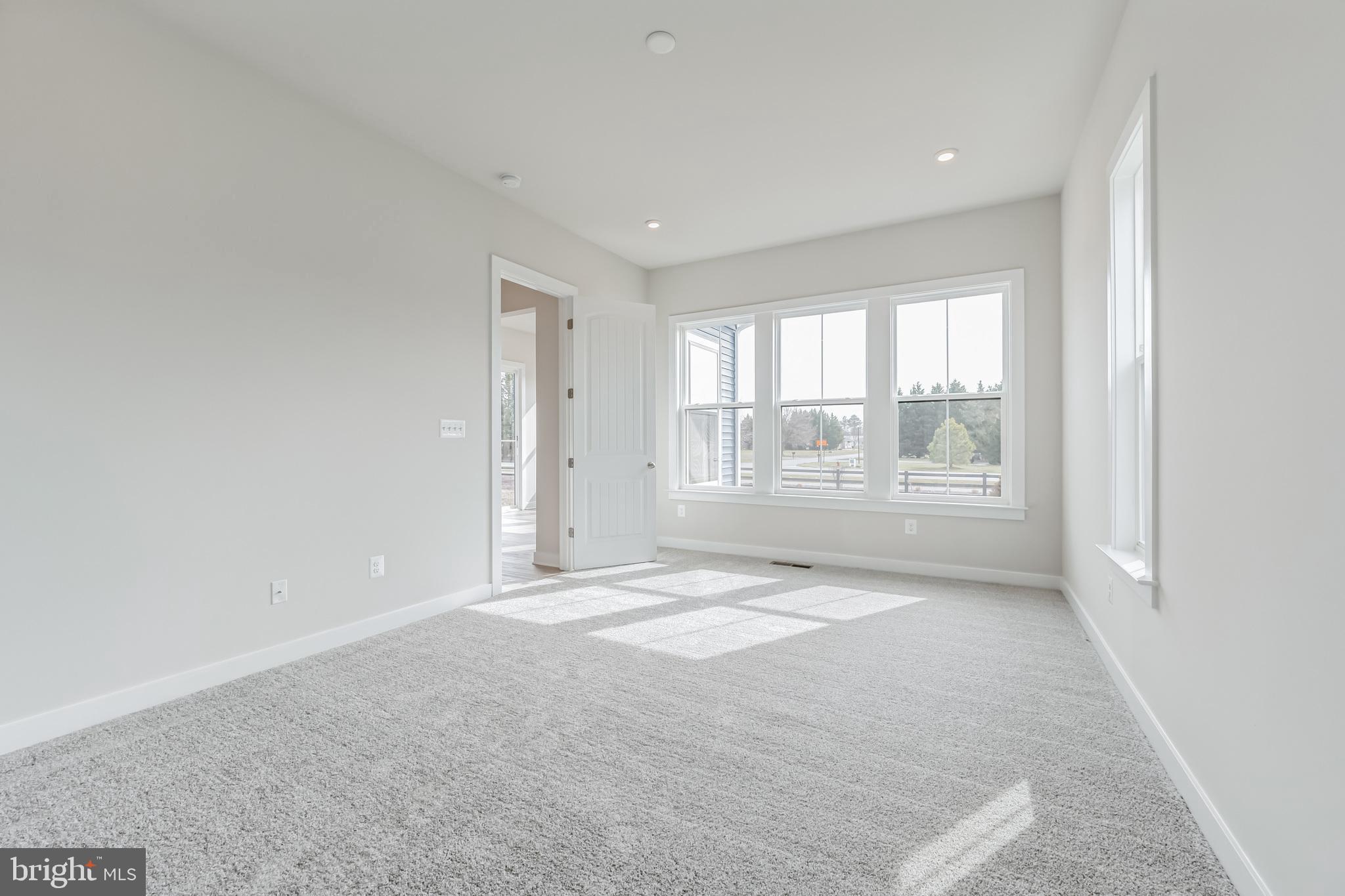 15513 Solomon Way Lewes, DE 19958 - Photo 12 of 20 a view of an empty room with a window