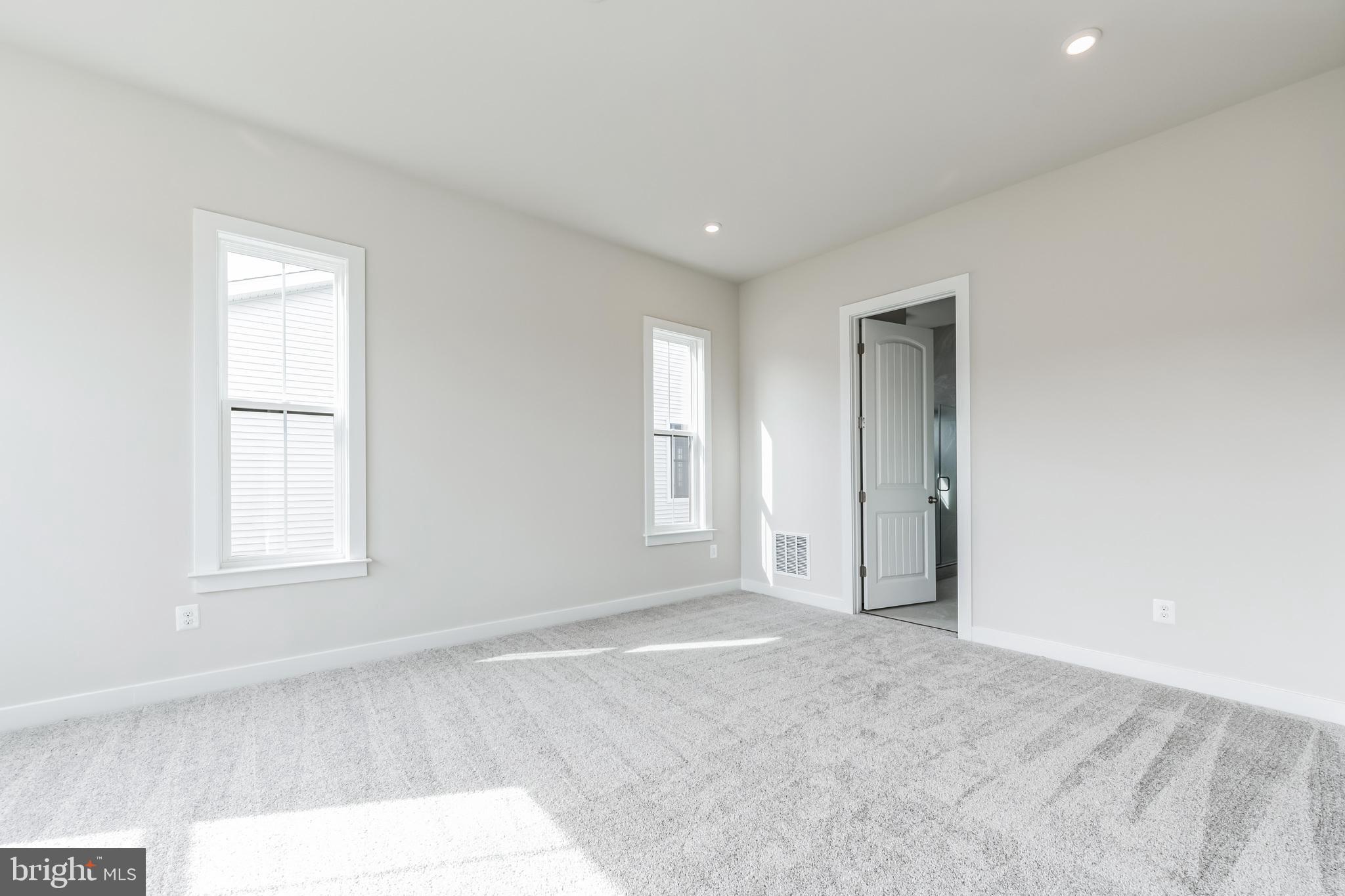 15513 Solomon Way Lewes, DE 19958 - Photo 13 of 20 an empty room with windows and closet