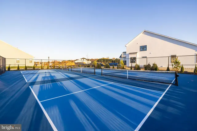 a living room with fireplace furniture and wooden floor