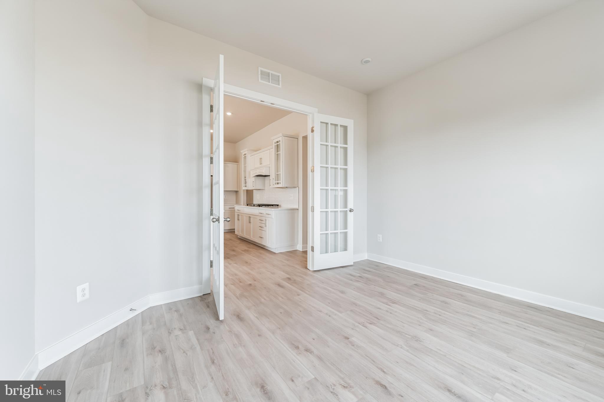 15513 Solomon Way Lewes, DE 19958 - Photo 2 of 20 wooden floor in an empty room